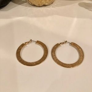 Women’s gold hoop earrings